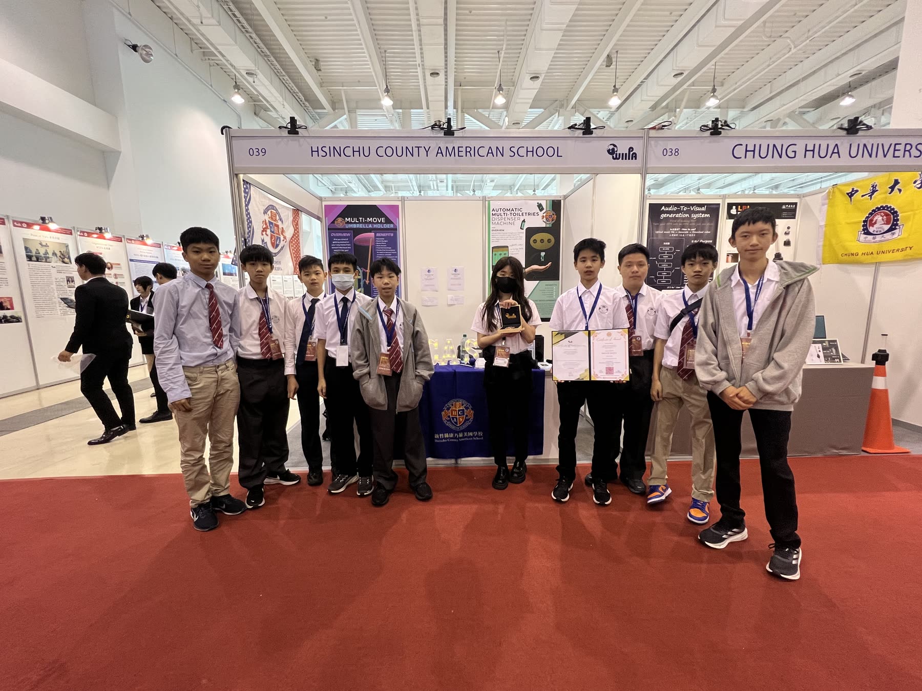 The team with their award certificate and trophy at KIDE 2025